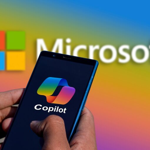 Microsoft Copilot - a person holding a cell phone in front of a microsoft logo