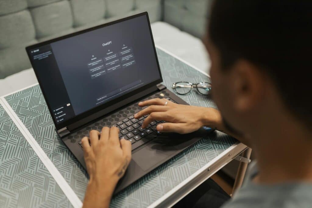 A person is using a laptop computer on a table