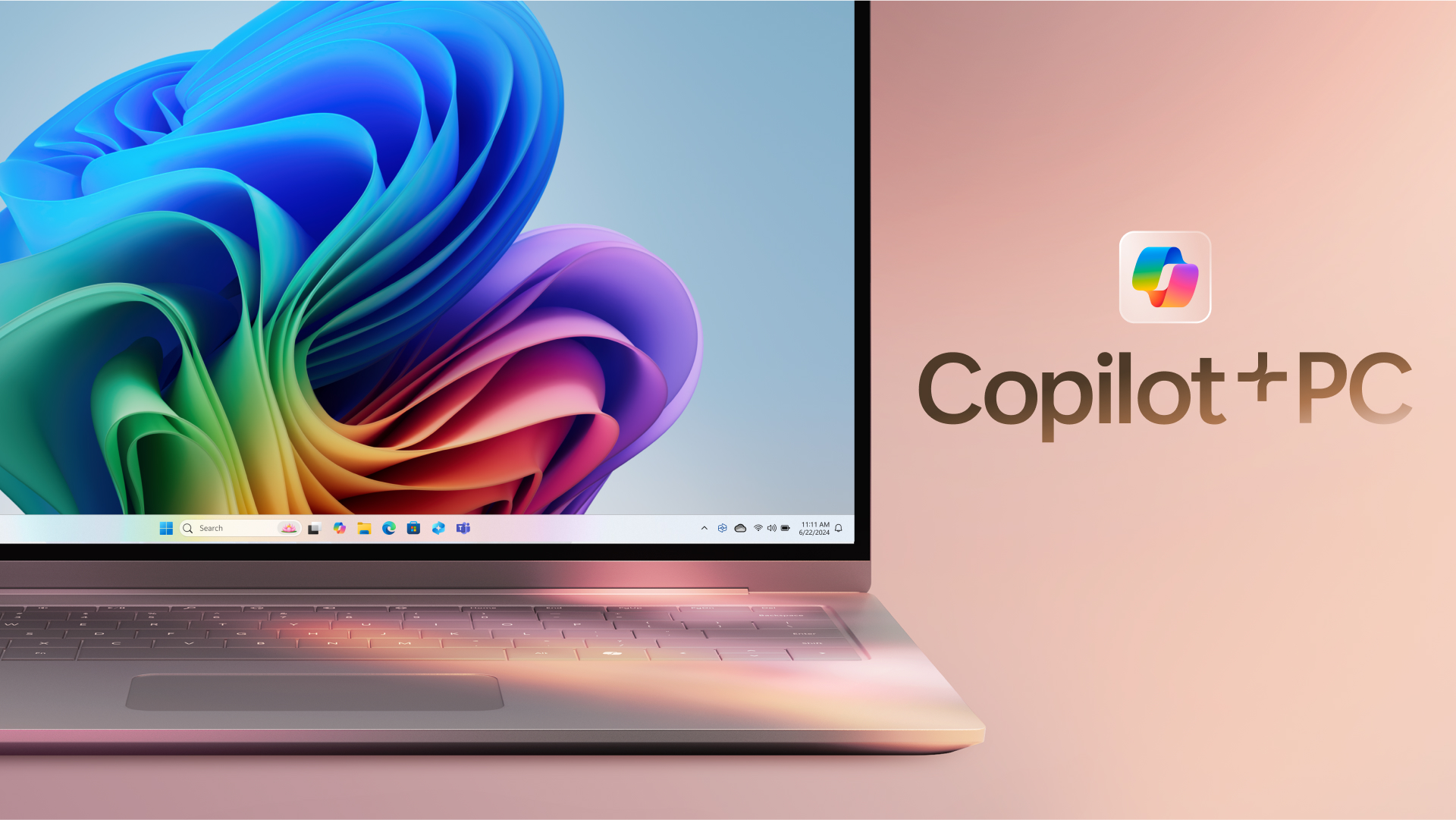 A laptop with a vibrant, multicolored abstract wallpaper displayed on the screen, alongside a Copilot+ PC logo on the right side of a secondary monitor with a light pink background.