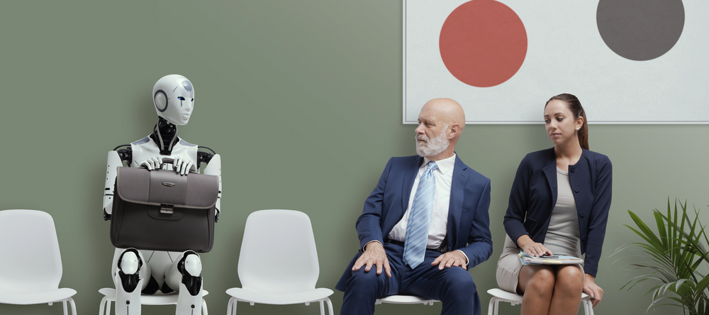 A robot in a waiting room holding a briefcase beside two people, highlighting AI predictions about AI entering office and hiring settings.