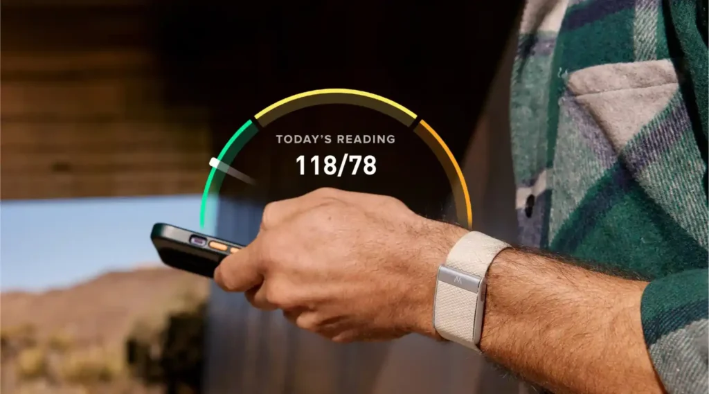 AI Wearables smartwatch worn on wrist outdoors showing health and activity tracking display with time and metrics.